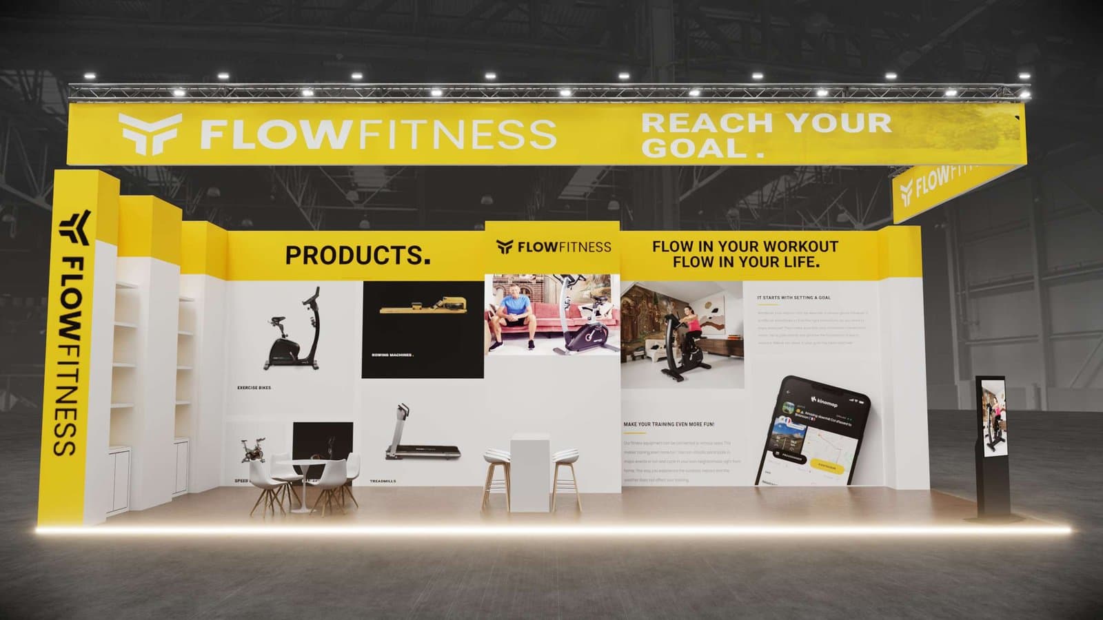 FlowFitness stand frontaal, gele truss met REACH YOUR GOAL bannering